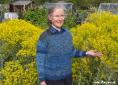 Teresinha with woad-dyed jumper & woad plants | Woad.org.uk